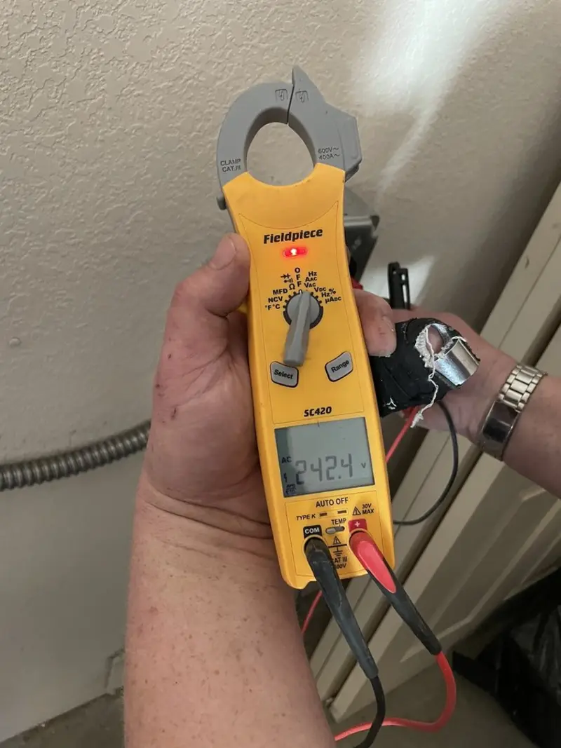 Voltage testing with clamp meter during Generator Installation in Davenport